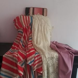 2 dresses and 2 wallets and a dress jacket